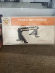 Ho Scale Bachmann Plasticville Pedestrian Bridge Kit( Brand New Sealed ). Fixed Price $27.99.