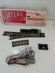 Atlas 50 Ho Gauge Model Railroad Accessory Remote Control Switch Left W/box. Fixed Price $10.00.
