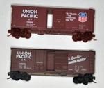 Scale Union Pacific (up) 2 Boxcars With Movable Doors, Lot 68. Fixed Price $30.00.