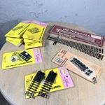 Vintage Atlas Ho Scale Train Track, Switches, Wheels & Bumpers Lot Of 11, Unused. Fixed Price $50.00.