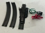 Bachmann Ho Scale Snap-fit E-z Remote Left Turnout + Curved Tracks. Fixed Price $24.99.