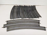Atlas #33 Ho Scale Lot Of (12) 18" Curved Track Good Condition. Fixed Price $12.99.