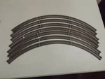 (7) Sections Ho Atlas 18" Curved Track. Fixed Price $12.99.