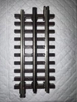 Atlas O Gauge 4 1/2" Straight 3 Rail Track, Item# 6051. Fixed Price $7.00.