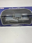 1957 Studebaker Golden Hawk, Die Cast Model Car Gunmetal Blue Scale: 1/18. Fixed Price $49.99.