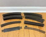 54 Pieces Of Atlas Snap Track 9" Straight & 18 Curved Black And Brass. Fixed Price $19.44.