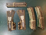 15 Ho Scale Marklin Metal 3 Rail Track Lot; 2 Switches, 10 Curved & Straight. Fixed Price $25.99.