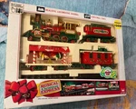 New Bright Musical Holiday Christmas Express Elf Train Locomotive 1990'S No. 183. Fixed Price $175.00.