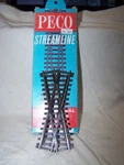 Peco #SL-93XX Scale Code 100, 24 Degree Short Crossing. Fixed Price $19.95.